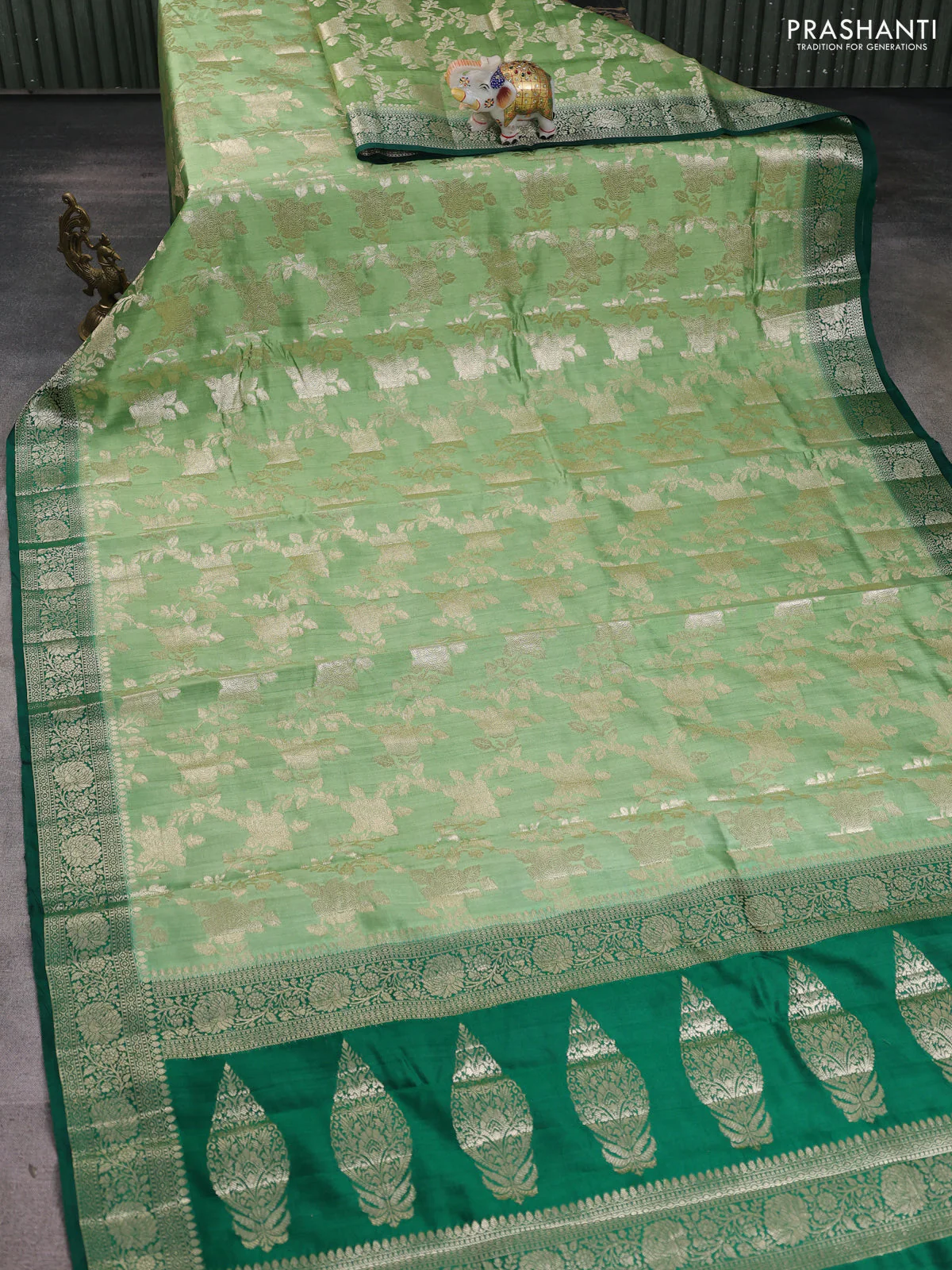 Chiniya silk saree pastel green and green with allover floral zari weaves and zari woven border - Image 2