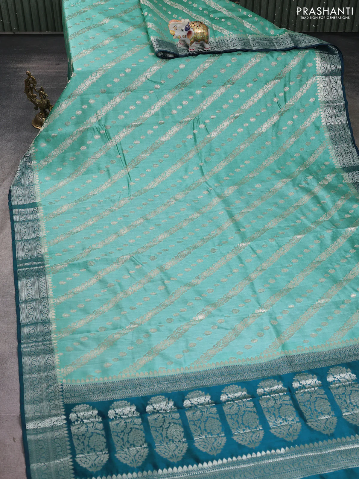 Chiniya silk saree teal blue and peacock blue with allover zari weaves and zari woven border - Image 2