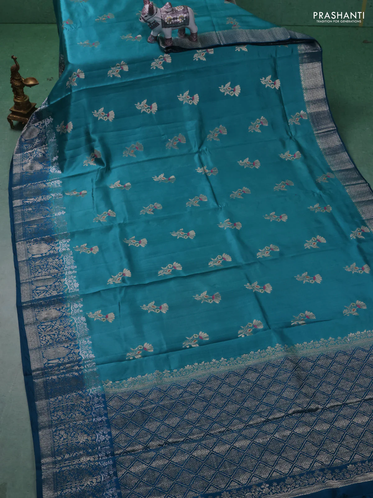 Chiniya silk saree teal blue and peacock blue with floral zari woven buttas and zari woven border - Image 2
