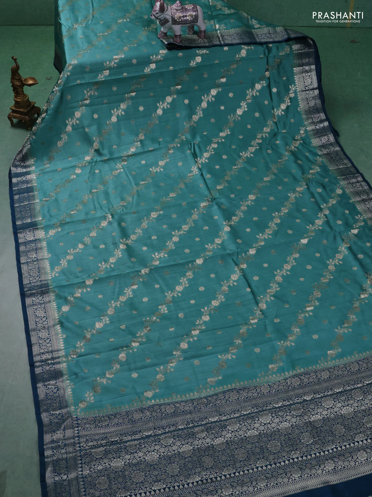 Chiniya silk saree teal blue shade and peacock blue with allover zari weaves and zari woven border - Image 2