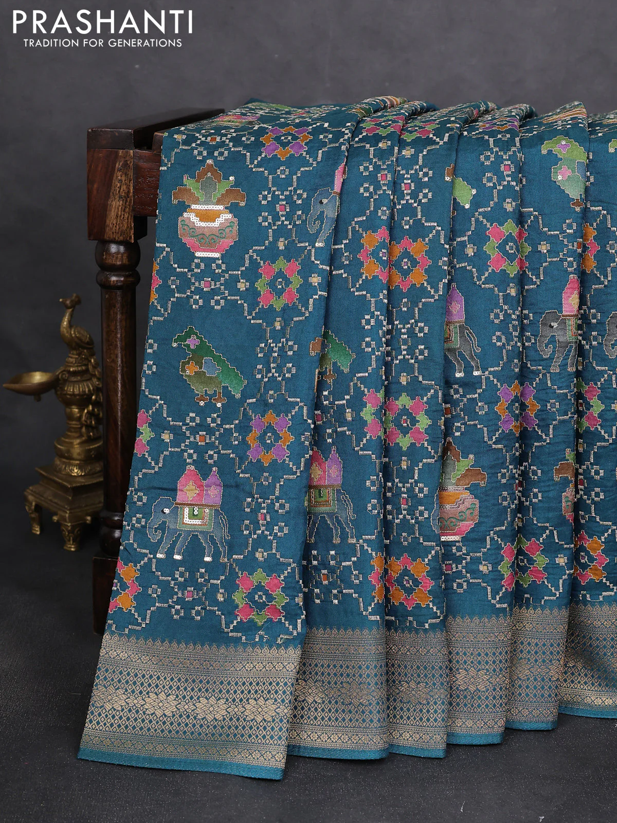 Crepe silk saree peaccock blue with allover mina weaves & sequin work and zari woven border - Image 2