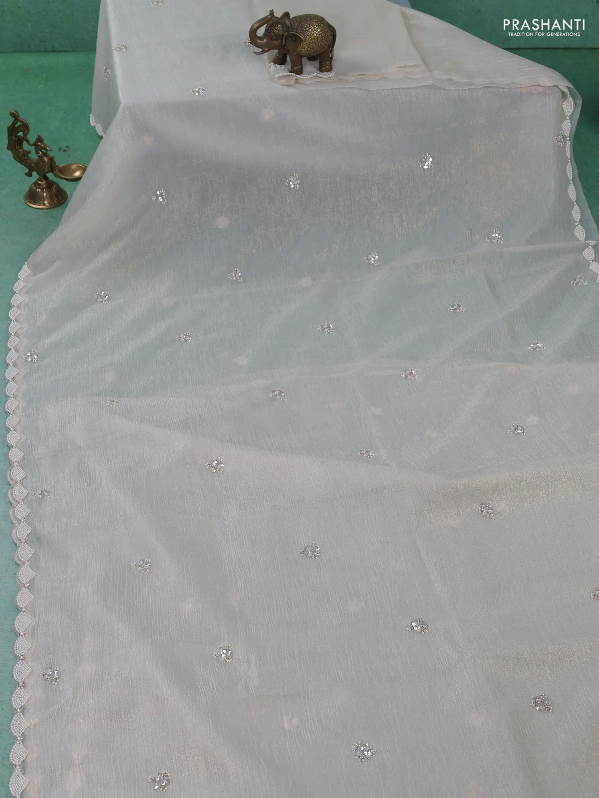 Crush tissue saree beige with sequin work buttas and beaded work border - Image 2