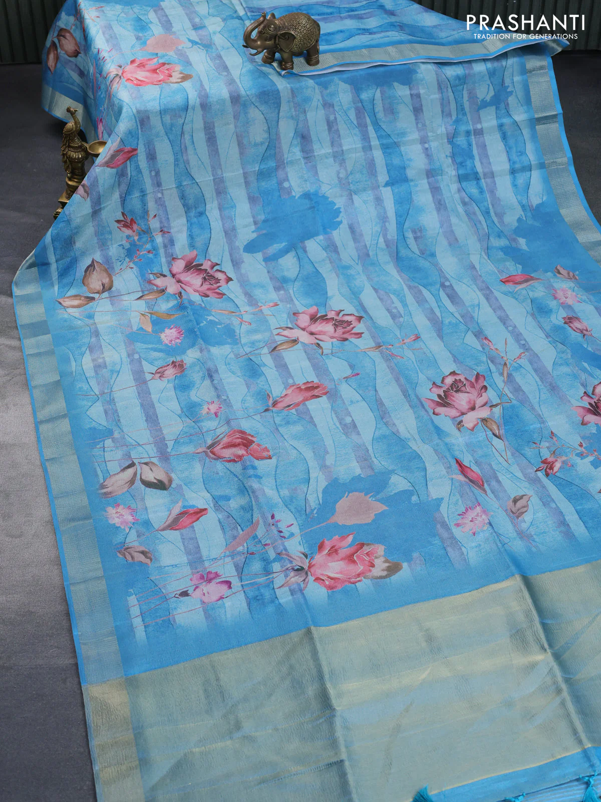 Crushed tissue saree light blue with allover floral digital prints and zari woven border - Image 2