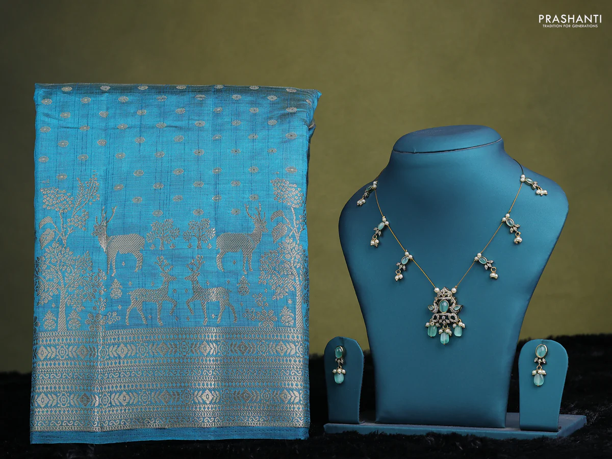 Cs blue raw silk saree with matching Neck piece