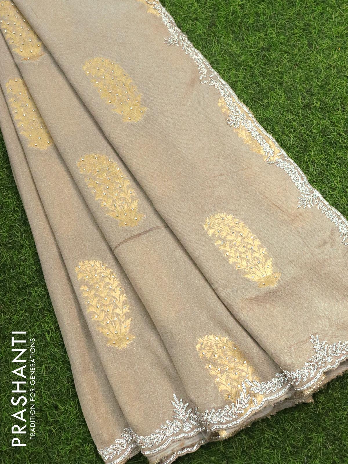 Designer semi georgette saree pastel grey with allover zari woven buttas & stone work