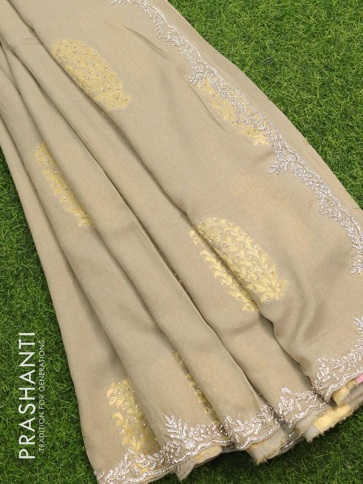 Designer semi georgette saree pastel grey with zari woven buttas & stone work