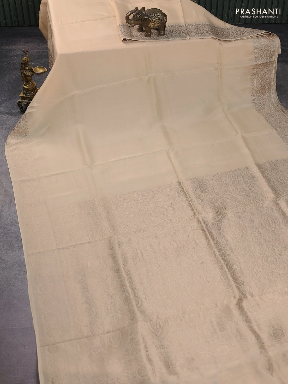 Dola silk saree cream with plain body and zari woven border - Image 2