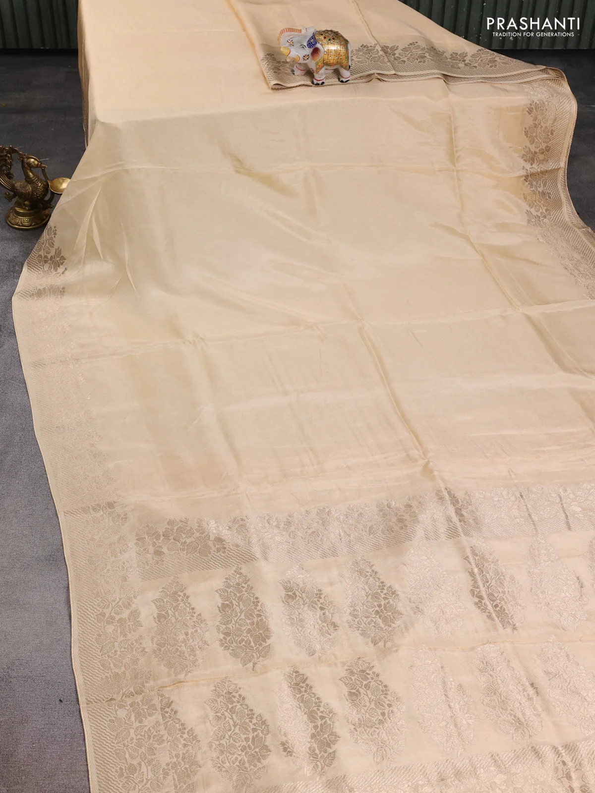 Dola silk saree cream with plain body and zari woven border - Image 2