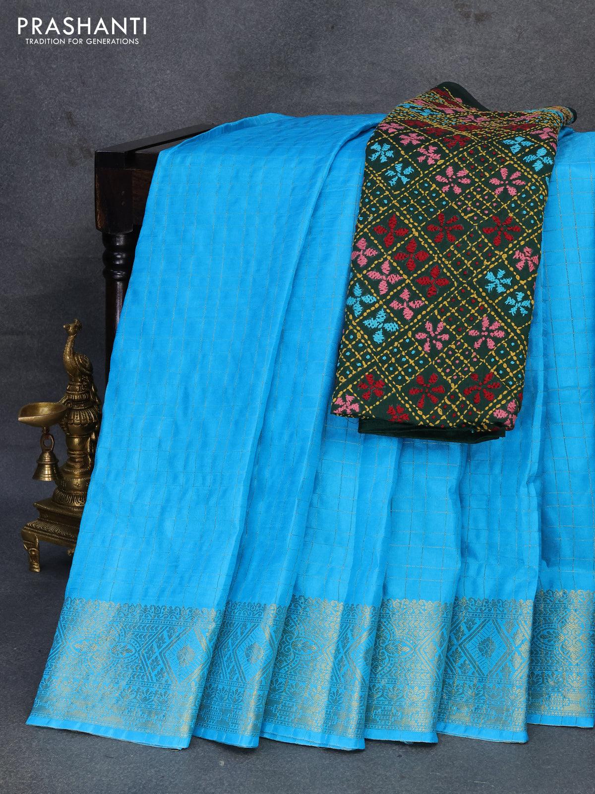 Dola silk saree light blue and green with zari checked pattern and zari woven border with embroidery work blouse