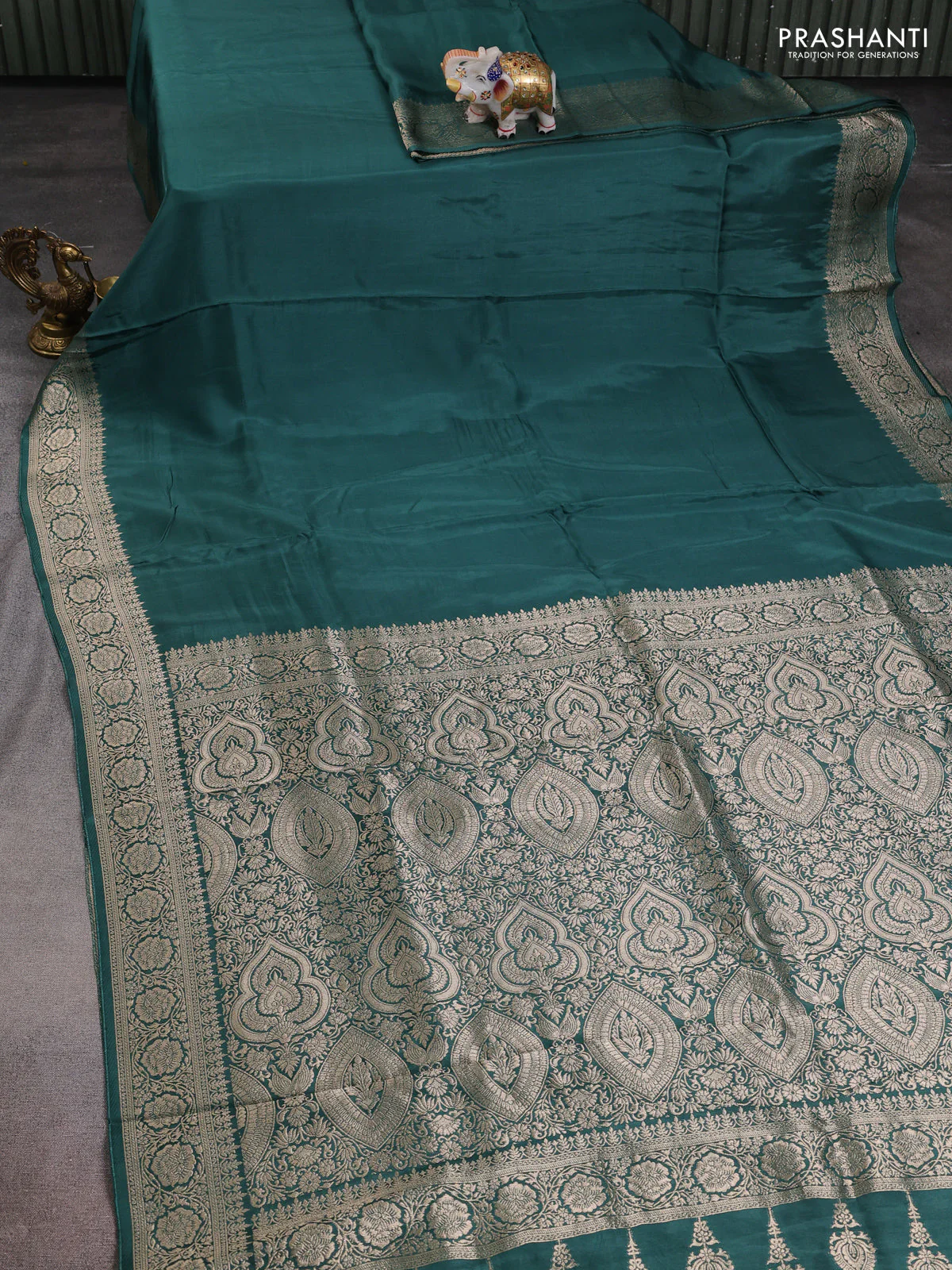 Dola silk saree peacock green shade with plain body and zari woven border - Image 2