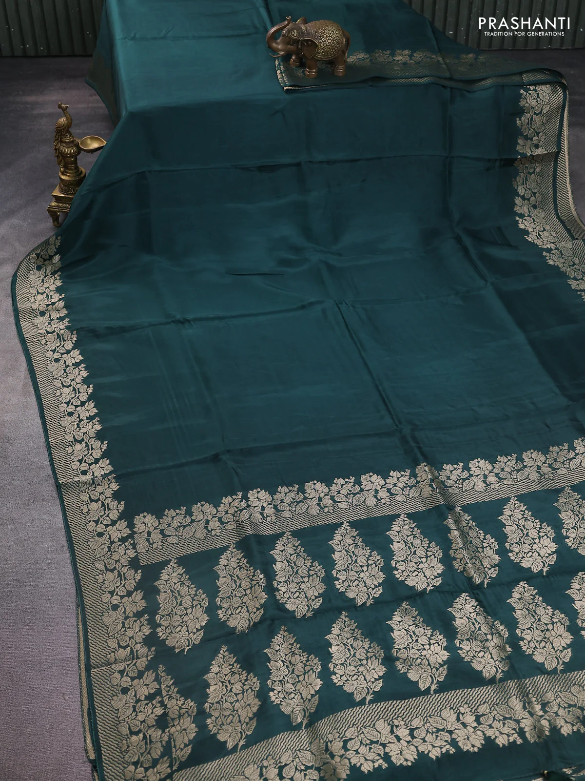 Dola silk saree peacock green shade with plain body and zari woven border - Image 2