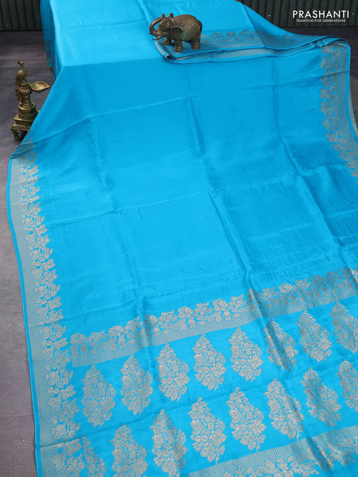 Dola silk saree teal blue with plain body and zari woven border - Image 2