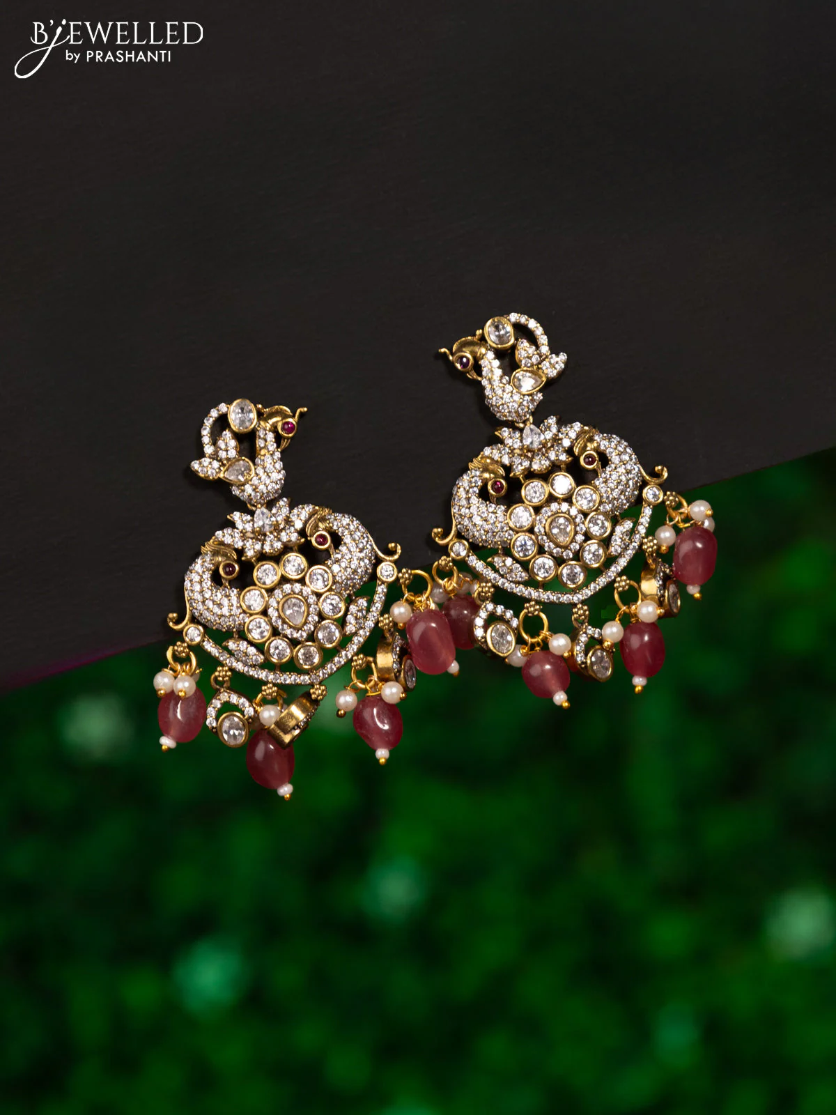 Earrings peacock design with ruby & cz stones and beads hanging in victorian finish