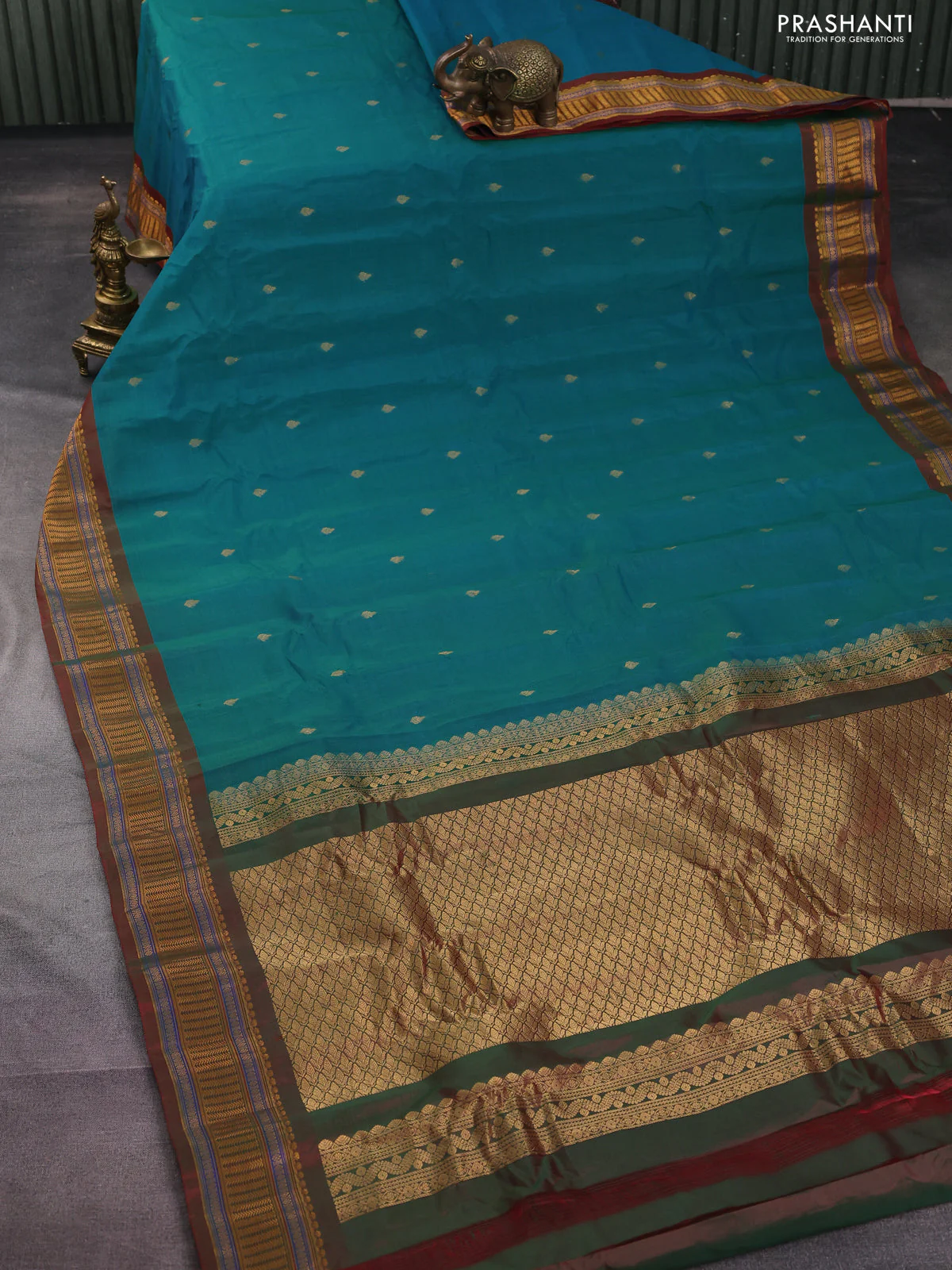 Gadwal silk cotton saree dual shade of teal greenish blue and dual shade of maroon with zari woven buttas and zari woven border - Image 2