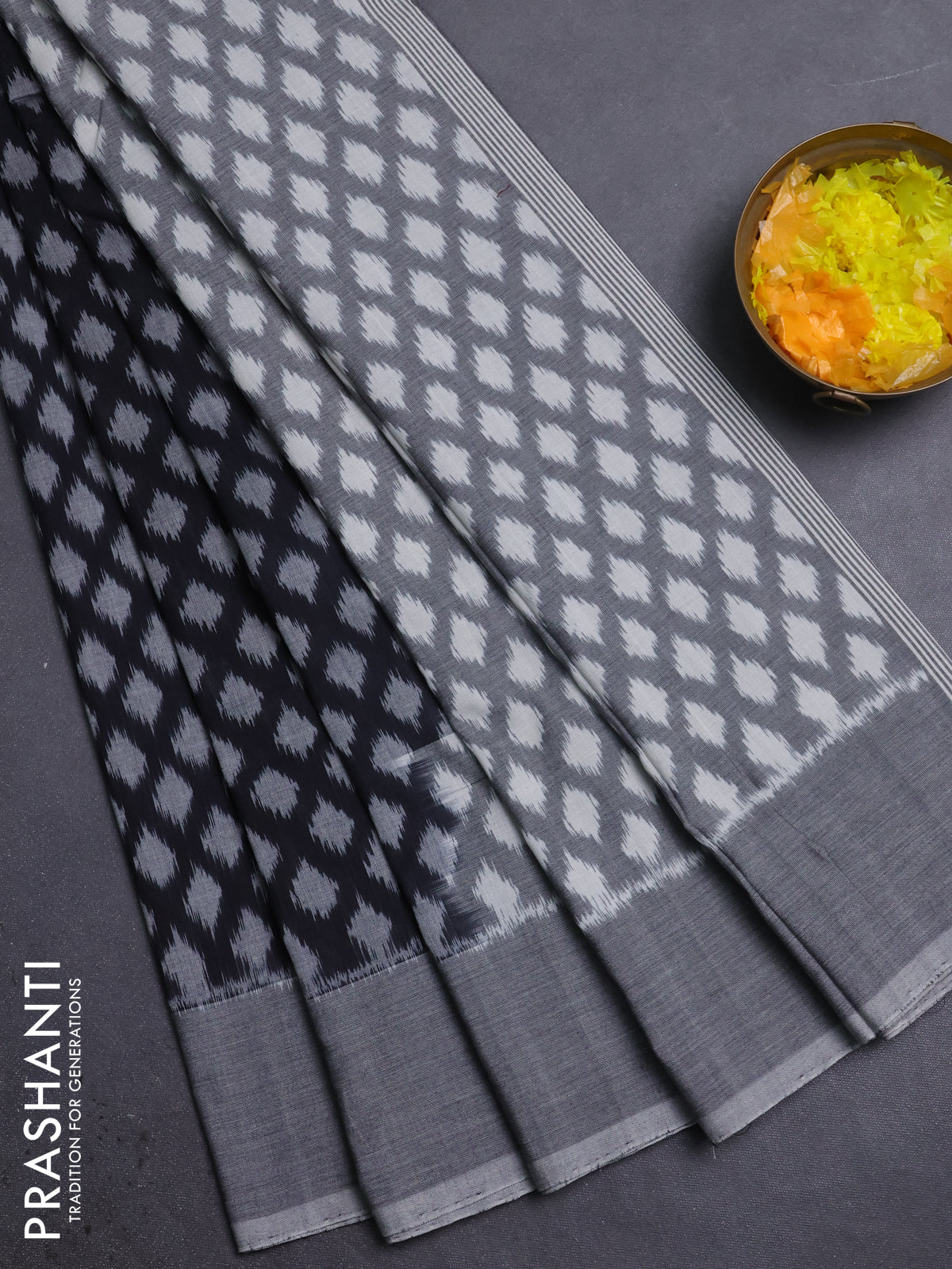 Ikat cotton saree black and grey with allover ikat weaves and simple border