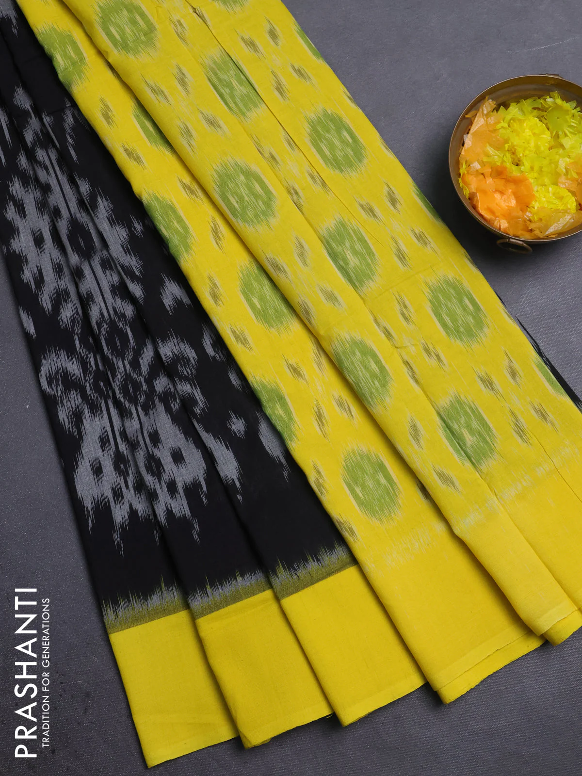 Ikat cotton saree black and yellow with allover ikat weaves and simple border