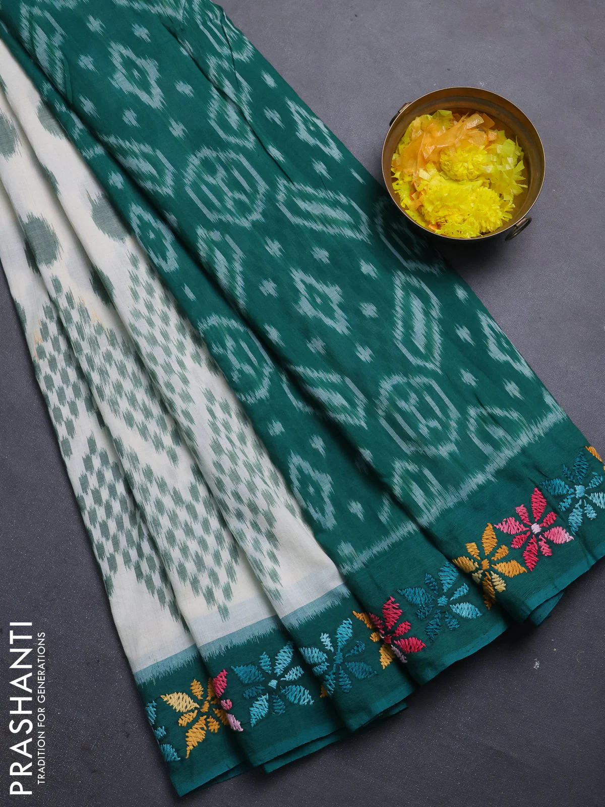 Ikat cotton saree cream and teal green with allover ikat weaves and kantha stitch work pallu