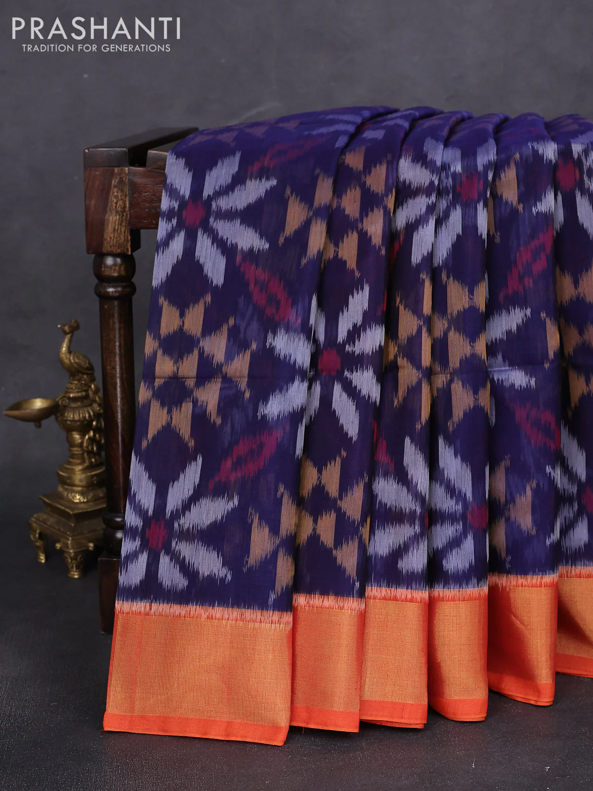 Ikat silk cotton saree blue and orange with alover ikat weaves and zari woven border