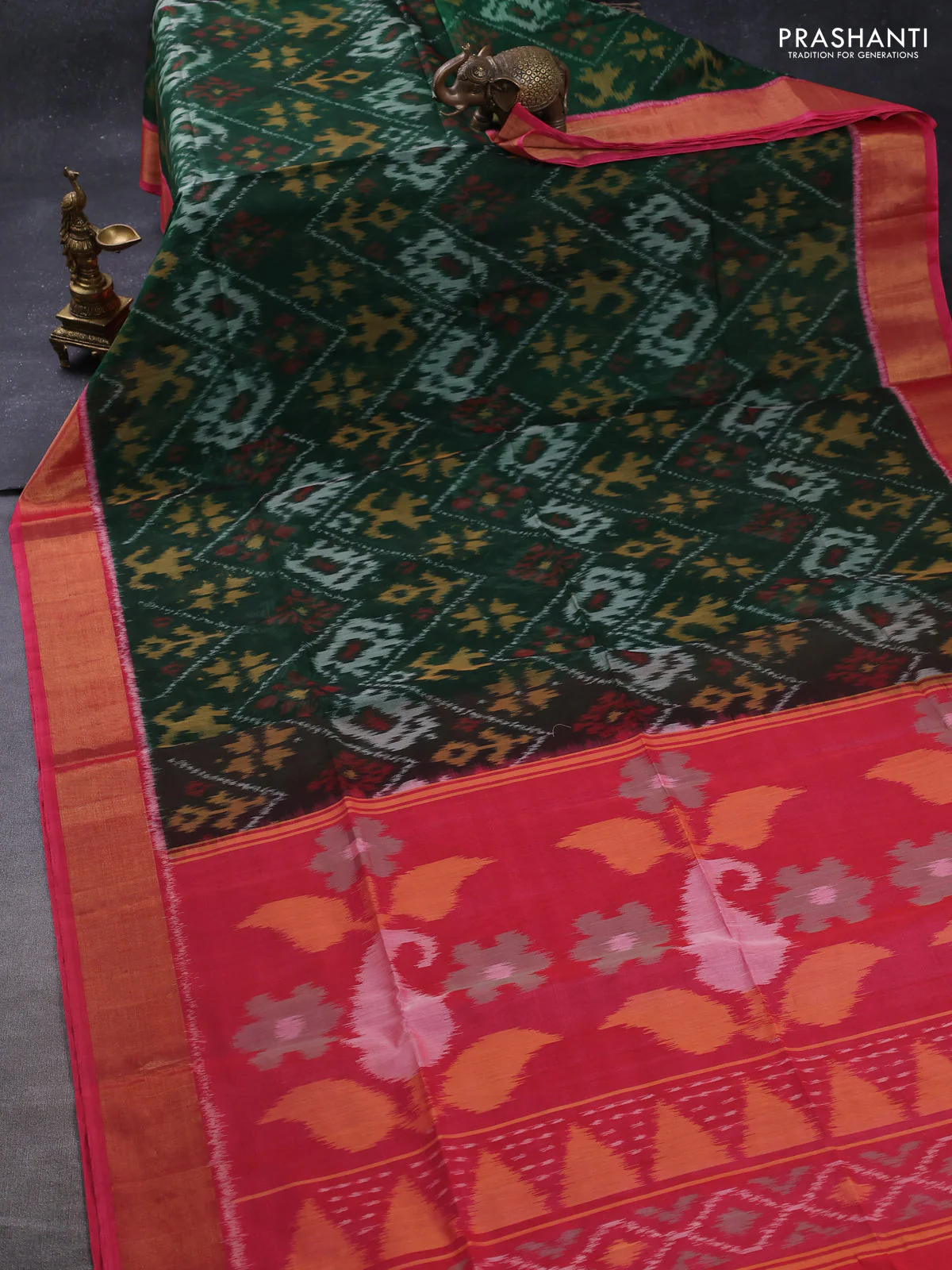 Ikat silk cotton saree bottle green and candy pink with allover ikat weaves and zari woven border - Image 2