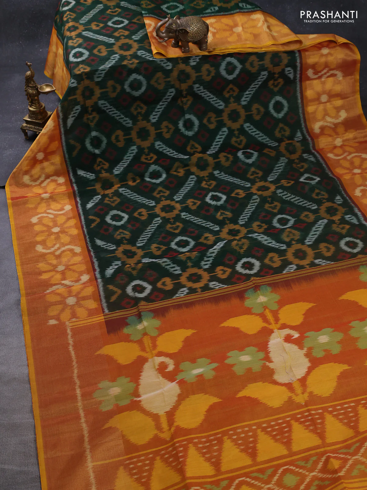 Ikat silk cotton saree bottle green and dual shade of dark mustard with allover ikat weaves and long zari woven ikat border - Image 2