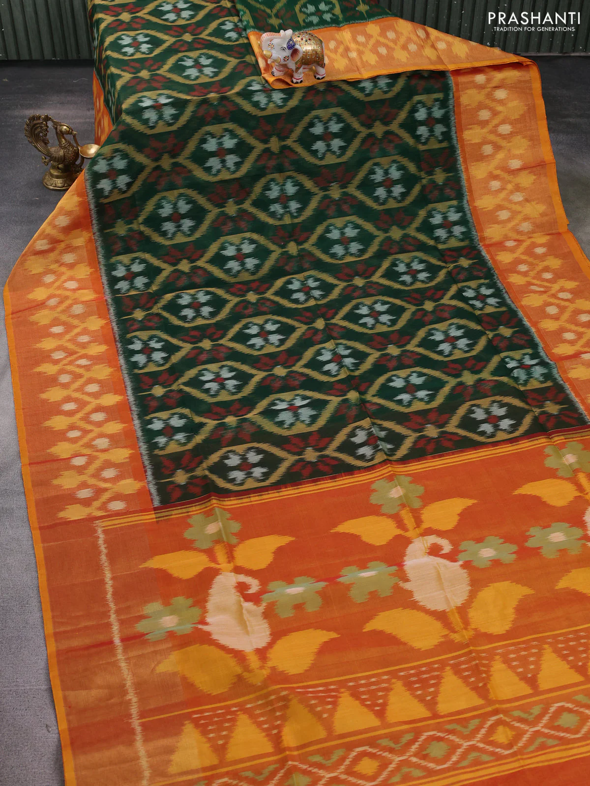 Ikat silk cotton saree bottle green and dual shade of dark mustard with allover ikat weaves and long zari woven ikat border - Image 2