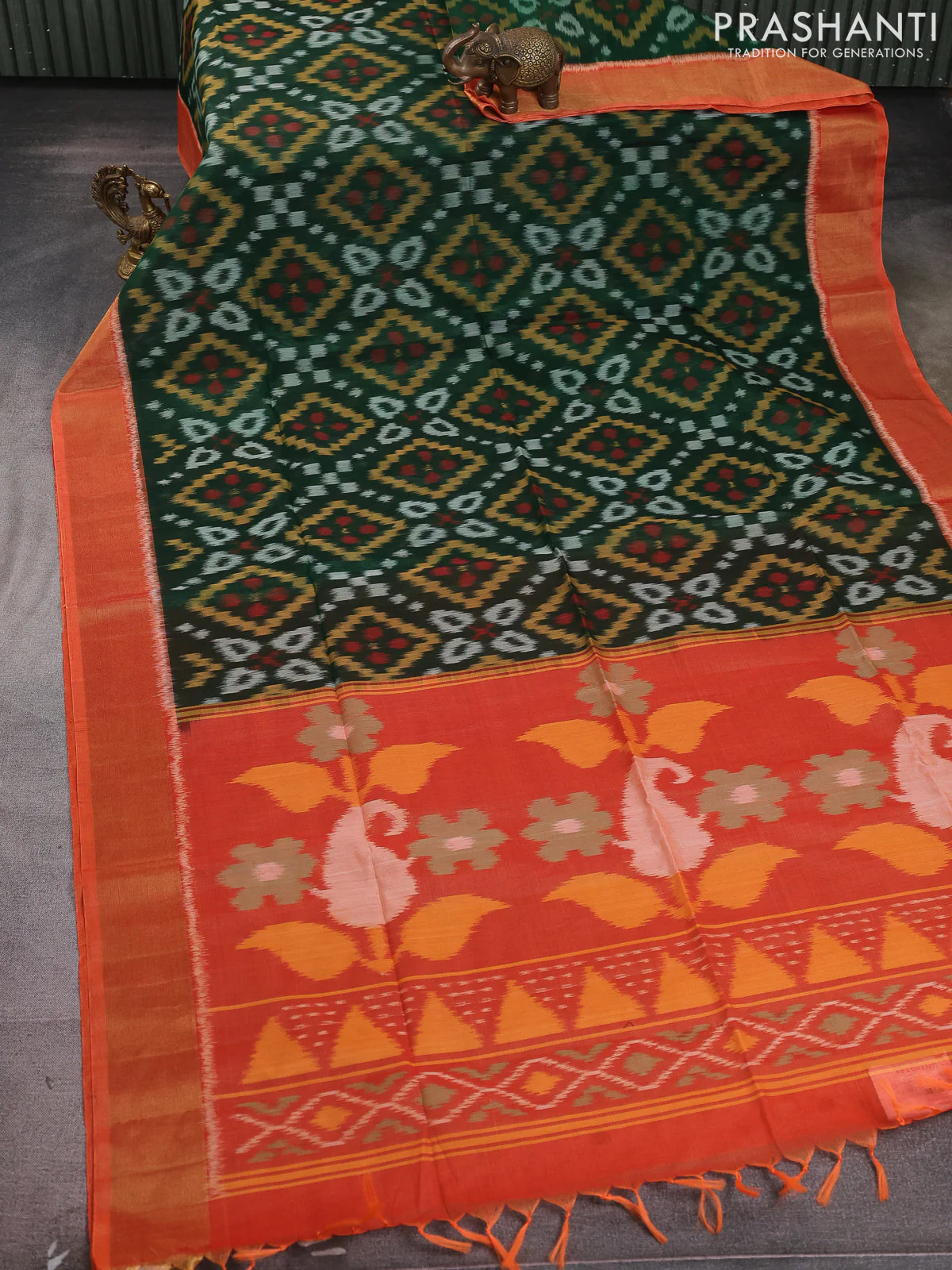 Ikat silk cotton saree bottle green and orange with allover ikat weaves and zari woven border - Image 2