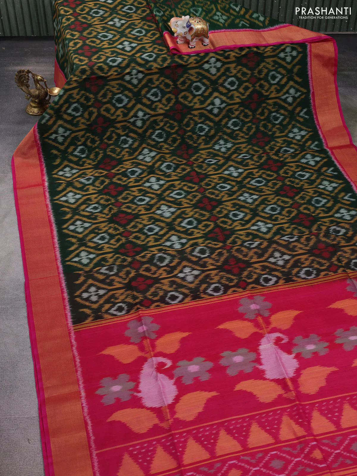 Ikat silk cotton saree bottle green and pink with allover ikat weaves and zari woven border - Image 2
