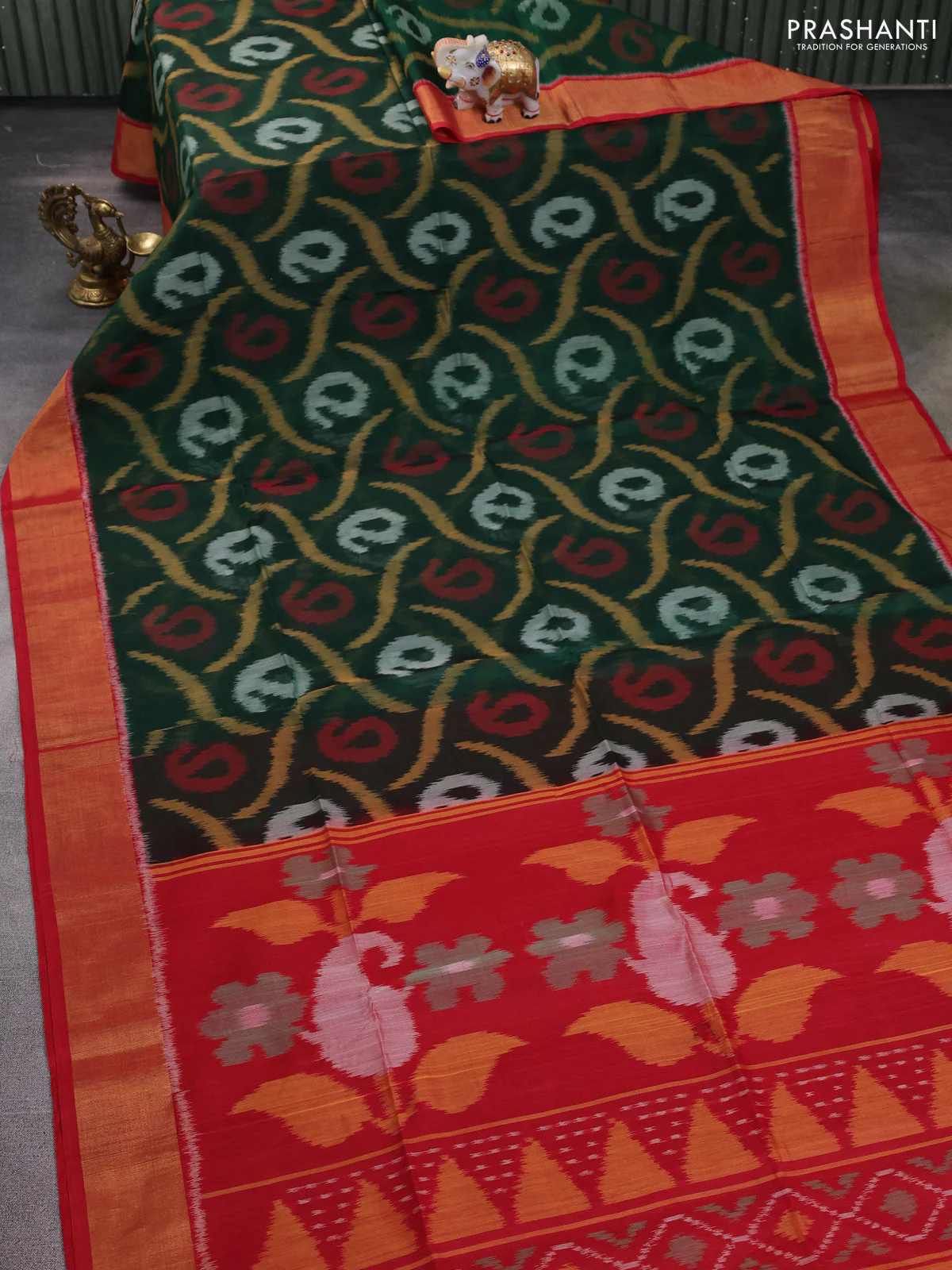 Ikat silk cotton saree bottle green and red with allover ikat weaves and zari woven border - Image 2