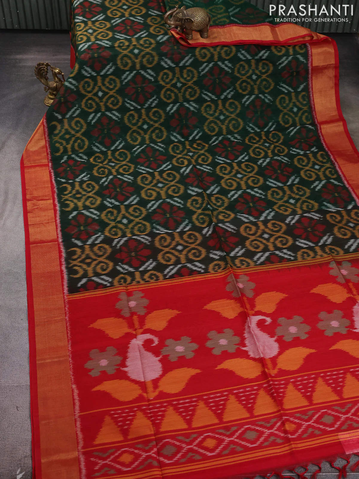 Ikat silk cotton saree bottle green and red with allover ikat weaves and zari woven border - Image 2