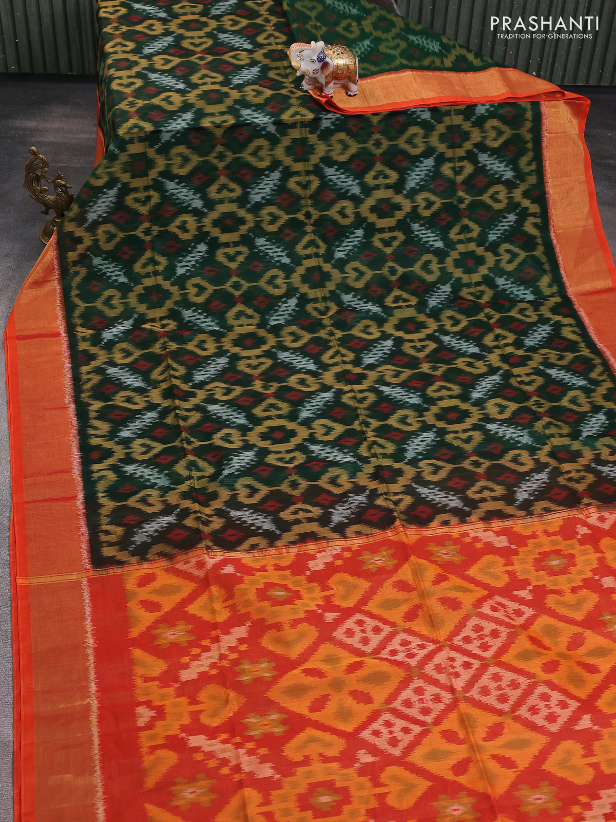 Ikat silk cotton saree green and orange with alover ikat weaves and zari woven border - Image 2