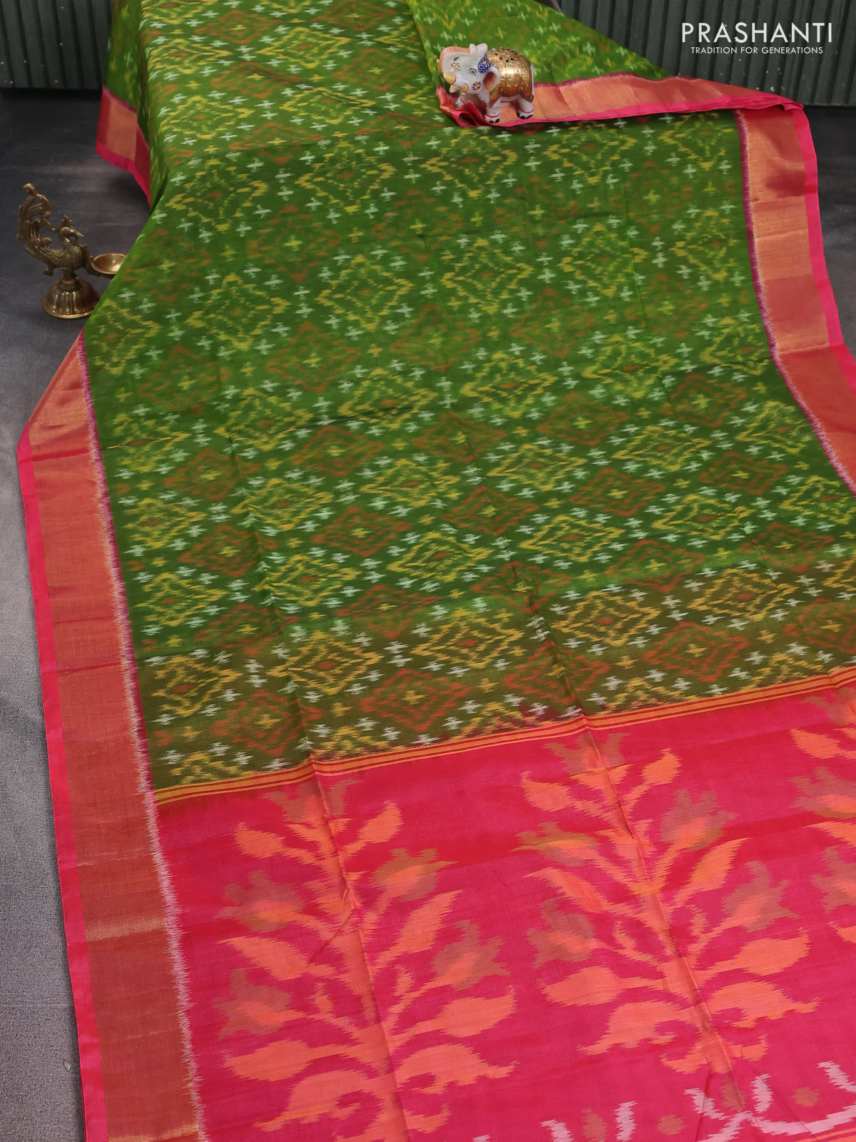 Ikat silk cotton saree green and peach pink with alover ikat weaves and zari woven border - Image 2
