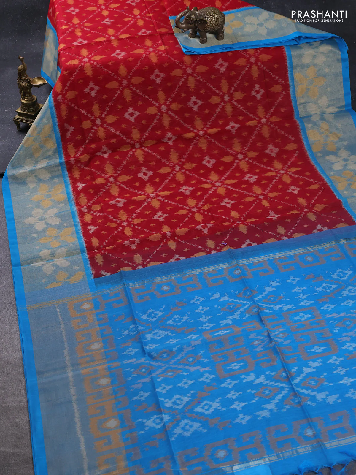 Ikat silk cotton saree kumkum red and cs blue with allover ikat weaves and long zari woven ikat border - Image 2