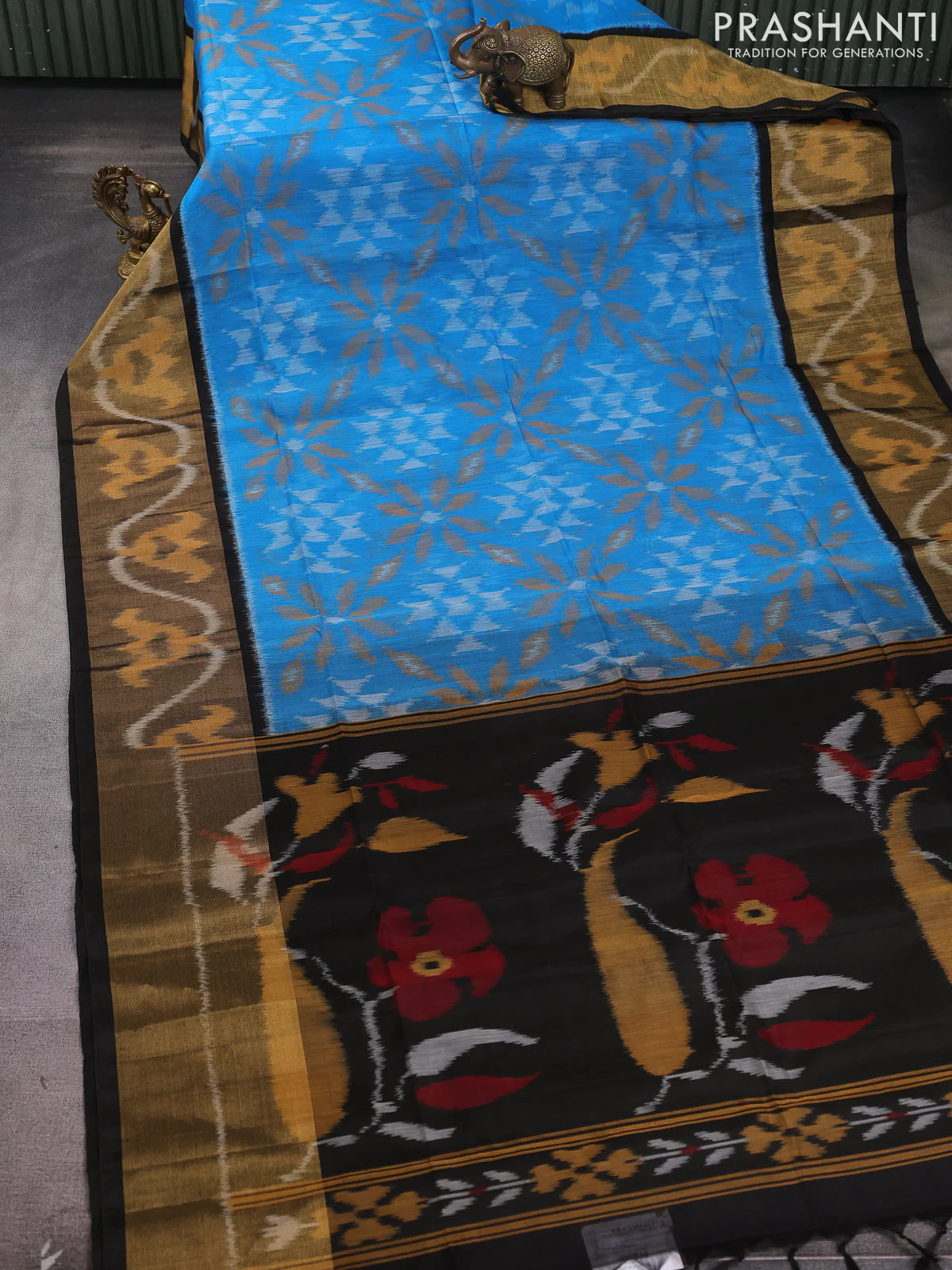 Ikat silk cotton saree light blue and black with allover ikat weaves and long zari woven ikat border - Image 2