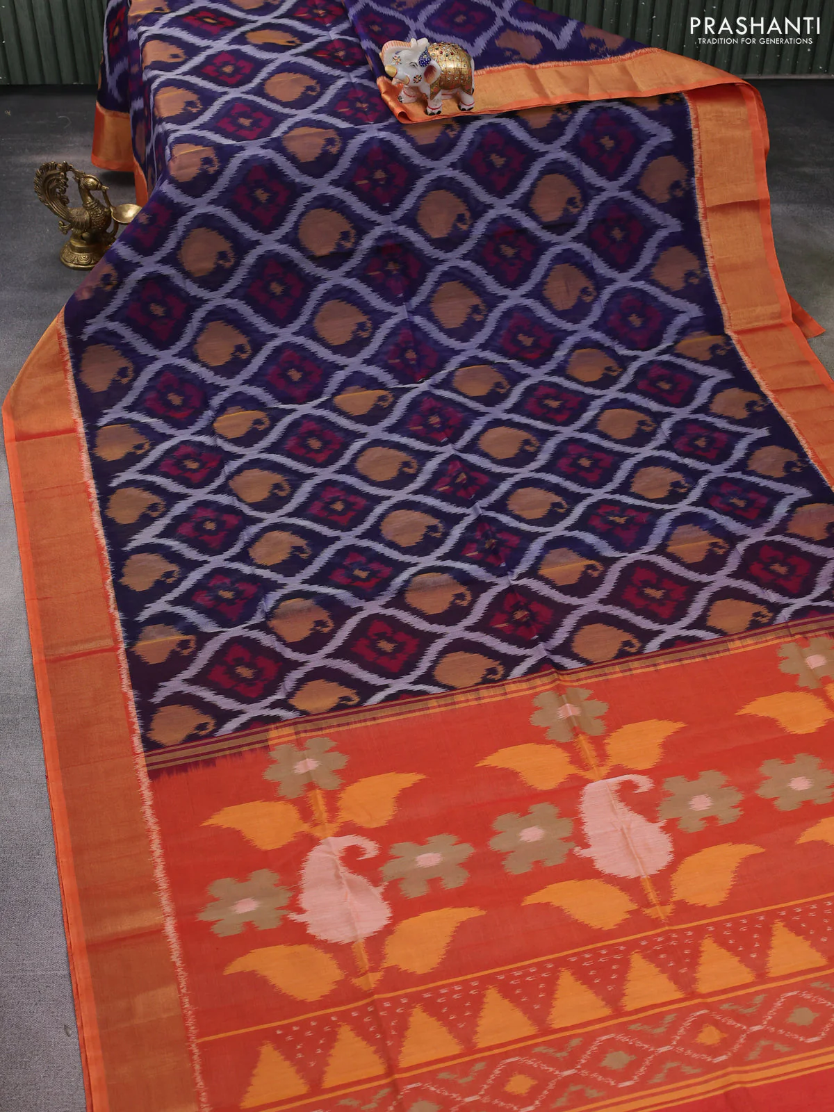 Ikat silk cotton saree navy blue and dual shade of rustic orange with allover ikat weaves and zari woven border - Image 2