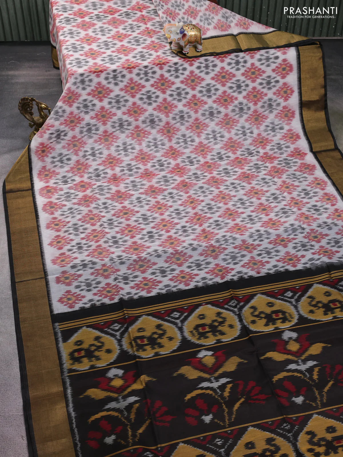 Ikat silk cotton saree off white and deep coffee brown with allover ikat weaves and zari woven border - Image 2