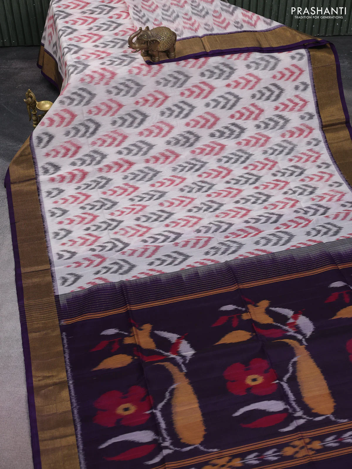 Ikat silk cotton saree off white and deep violet with allover ikat butta weaves and zari woven border - Image 2
