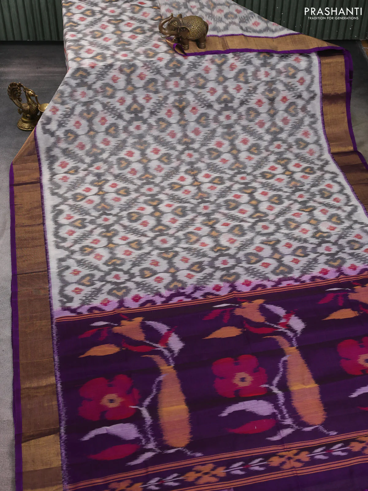 Ikat silk cotton saree off white and purple with allover ikat weaves and zari woven border - Image 2