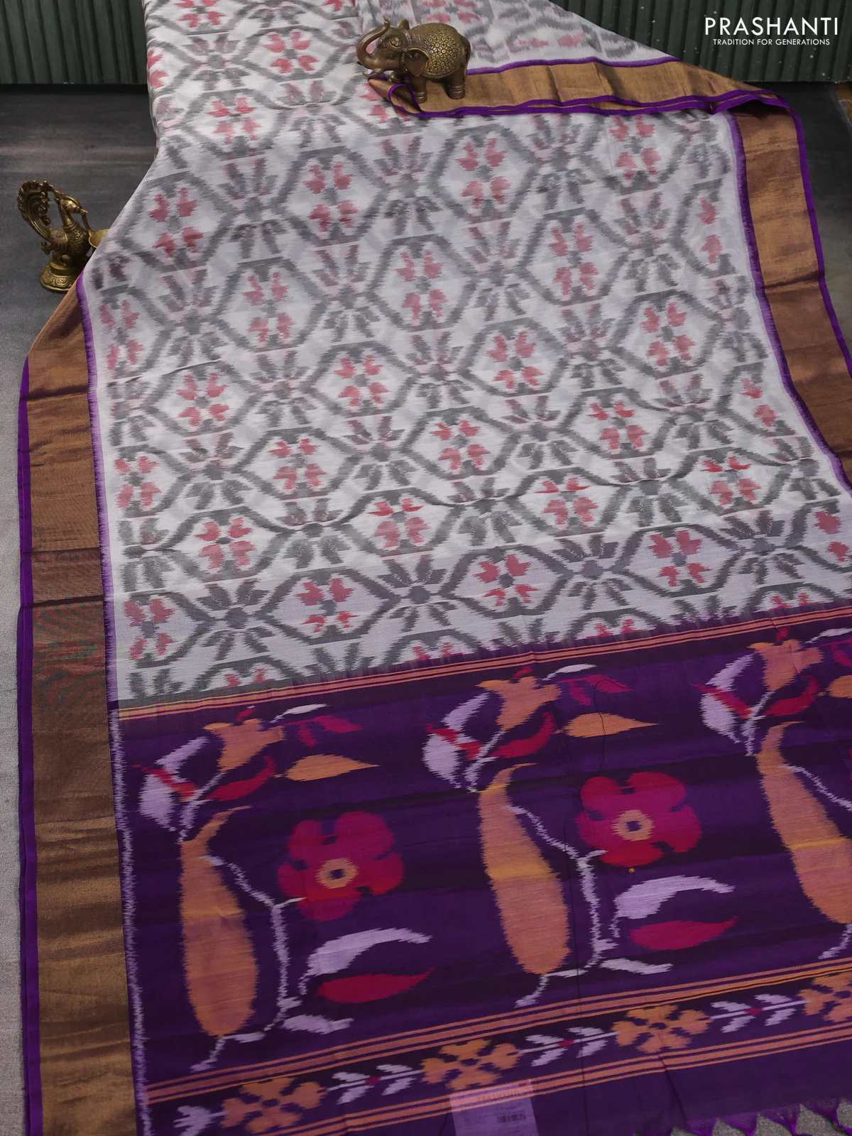 Ikat silk cotton saree off white and purple with allover ikat weaves and zari woven border - Image 2