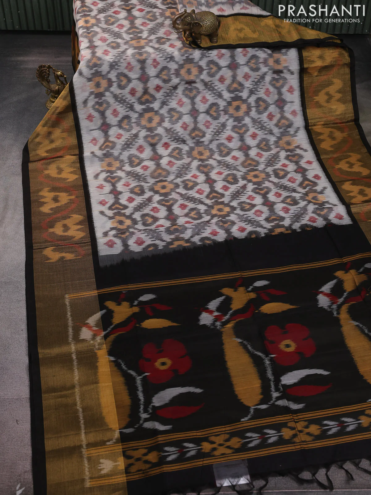 Ikat silk cotton saree off white grey and black with allover ikat weaves and long zari woven ikat border - Image 2