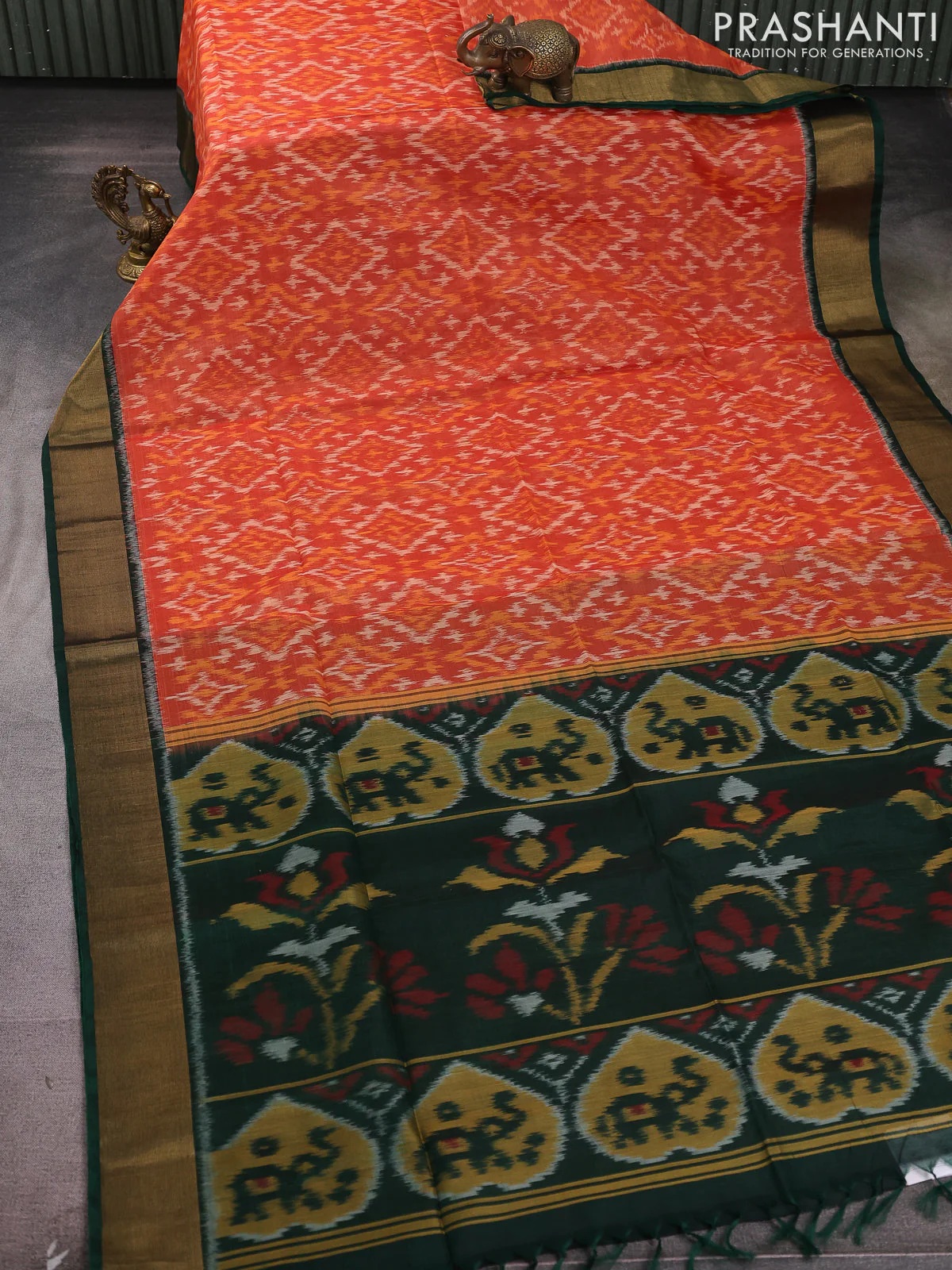 Ikat silk cotton saree orange and bottle green with allover ikat weaves and zari woven border - Image 2