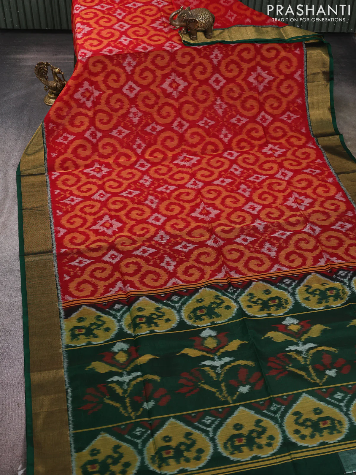 Ikat silk cotton saree red and bottle green with allover ikat weaves and zari woven border - Image 2