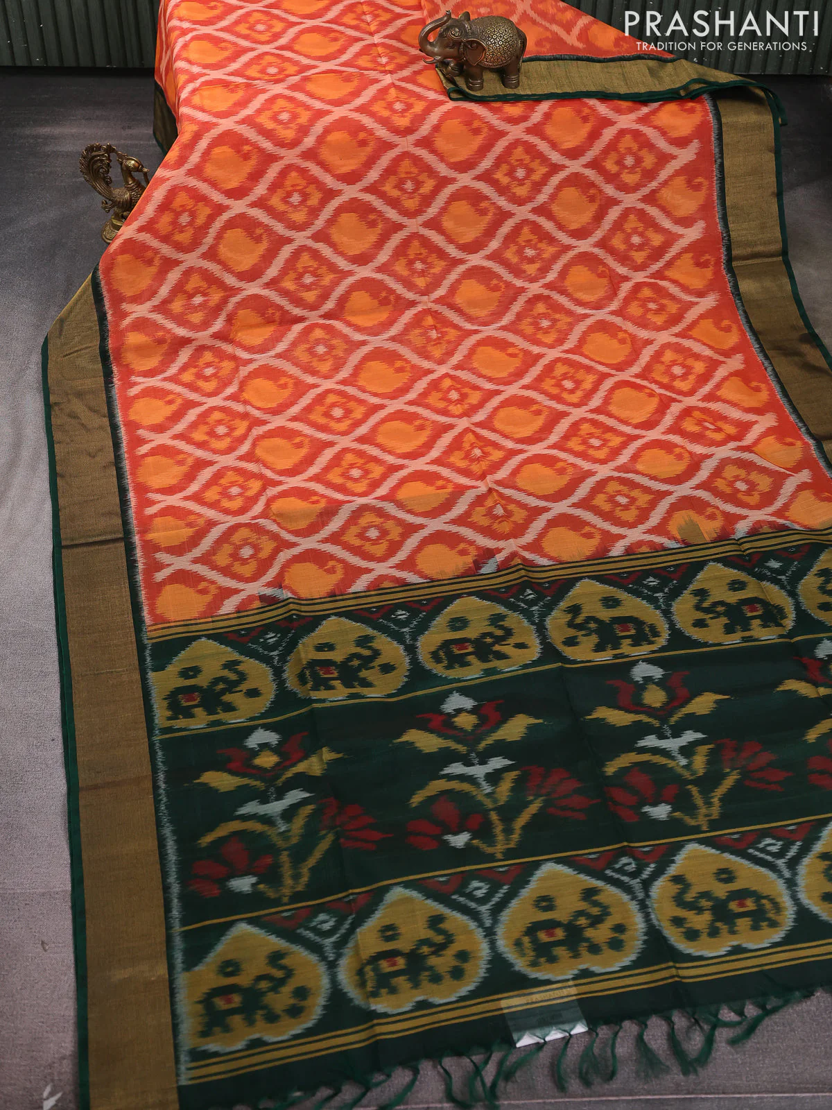 Ikat silk cotton saree rustic orange and bottle green with allover ikat weaves and zari woven border - Image 2