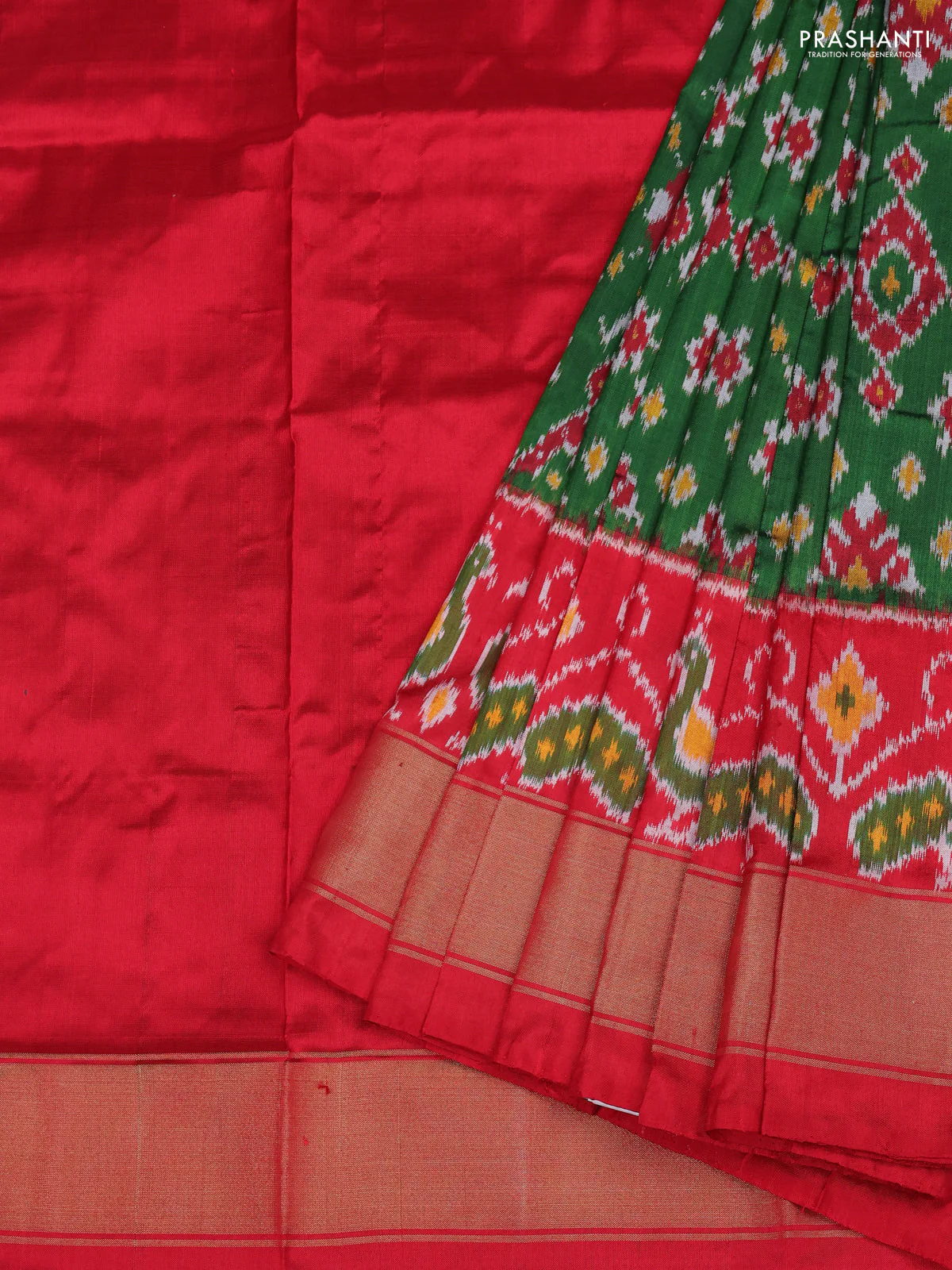 Ikat silk kids lehenga green and red with allover ikat weaves and long ikat woven zari border
