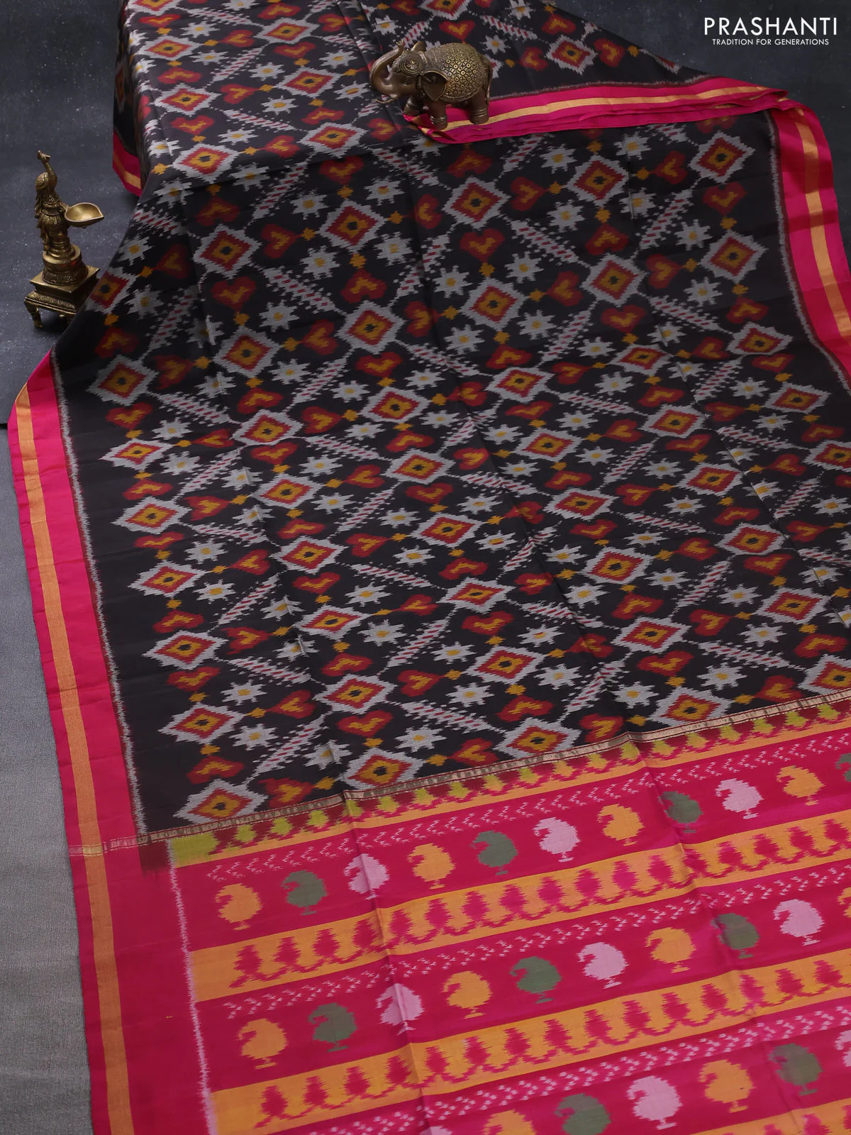Ikat soft silk saree black and pink with allover ikat weaves and zari woven border - Image 2