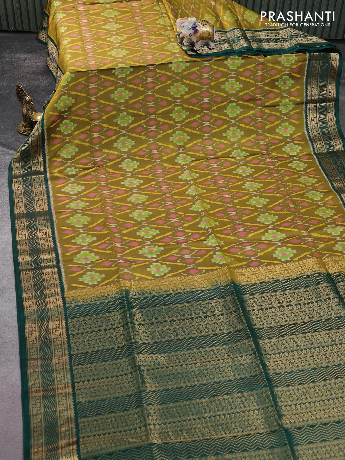 Ikat soft silk saree mehendi green and green with allover ikat weaves and zari woven border - Image 2