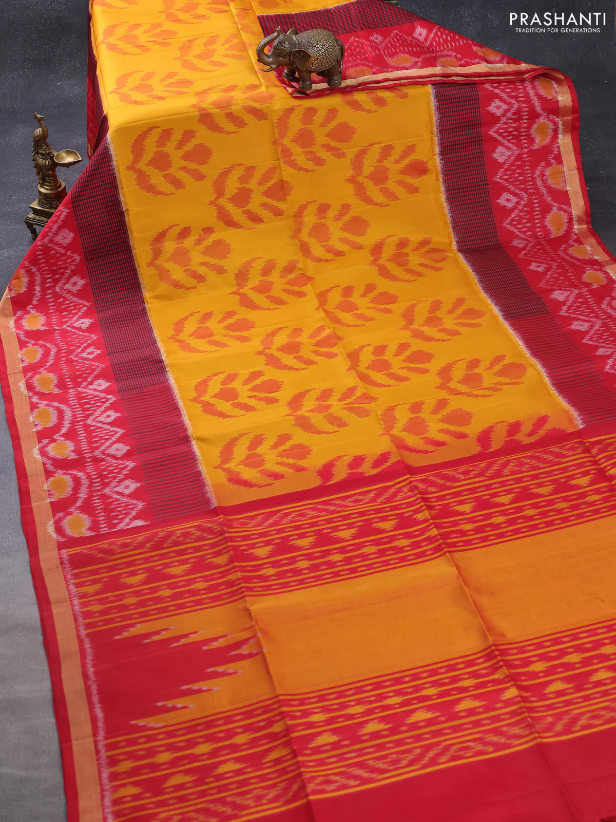 Ikat soft silk saree mustard yellow and red with allover ikat butta weaves and long ikat woven zari border - Image 2