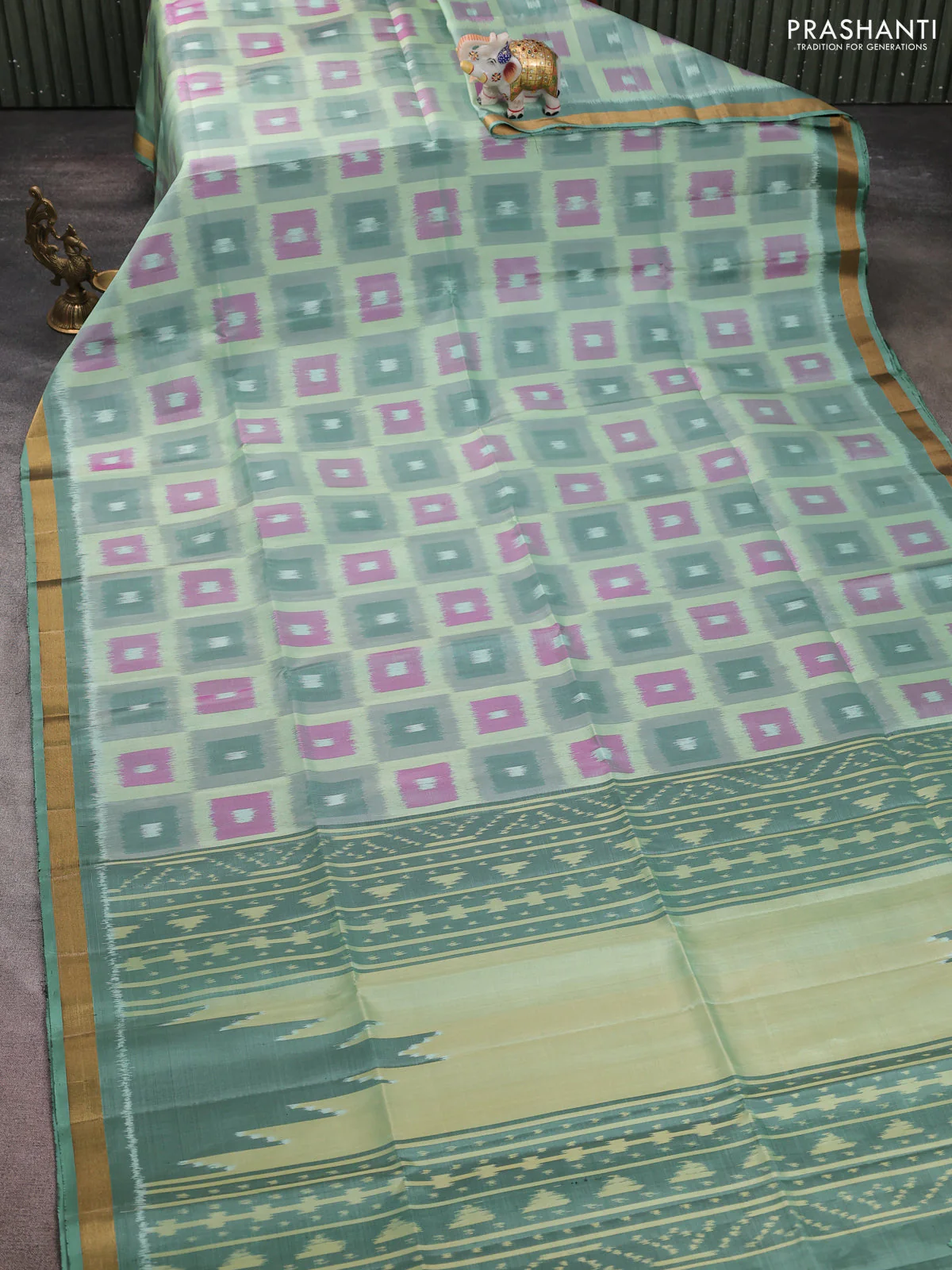 Ikat soft silk saree pastel green with allover ikat weaves and zari woven border - Image 2