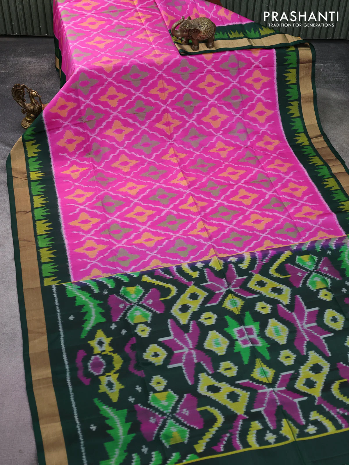 Ikat soft silk saree pink and green with allover ikat weaves and ikat style zari border - Image 2