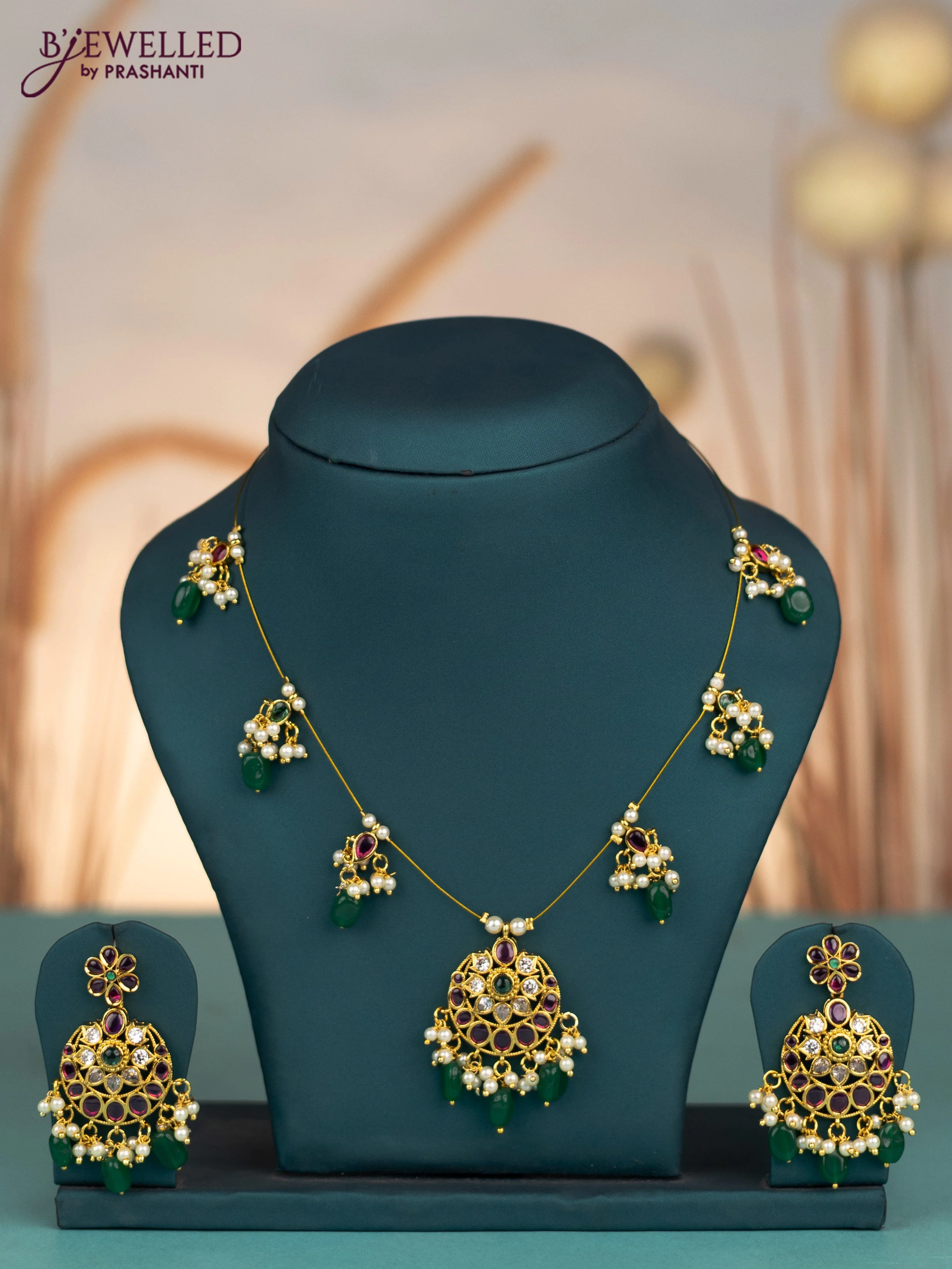 Invisible chain with kemp & cz stones and pearl & green beads hangings