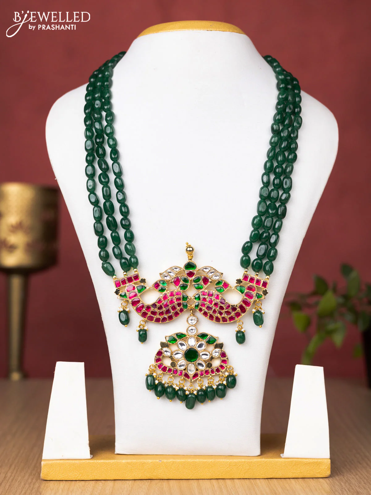 Jadau beaded green haaram matsya pendant with jadau kundan stones and pearl & beads hanging without earrings